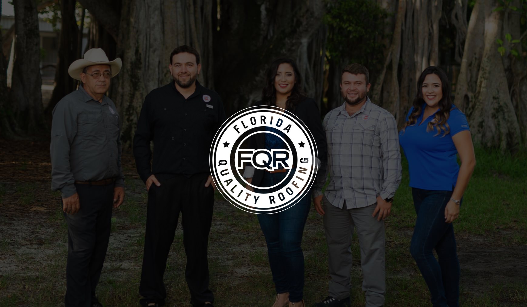 White Florida Quality Roofing logo on dimmed background of group of FQR employees made up of two women and three men posing for a picture