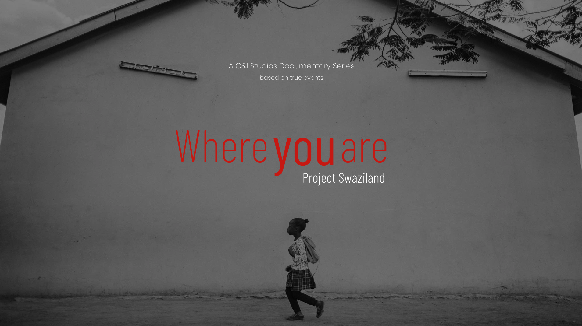 Where You Are Documentary Series Feature film mastering and delivery services by C&I studios Black and white side profile of girl walking past a building wearing a skirt and backpack