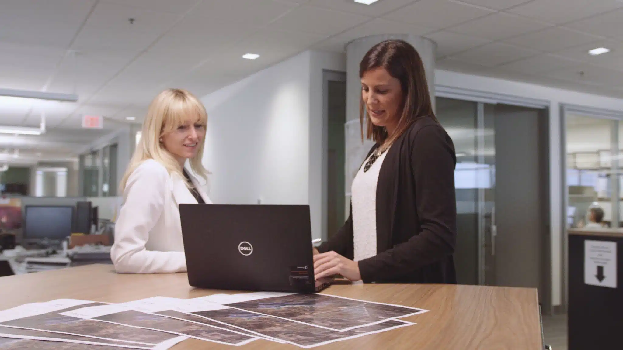 The type of crew you need to make a commercial Two women looking at a laptop in an office