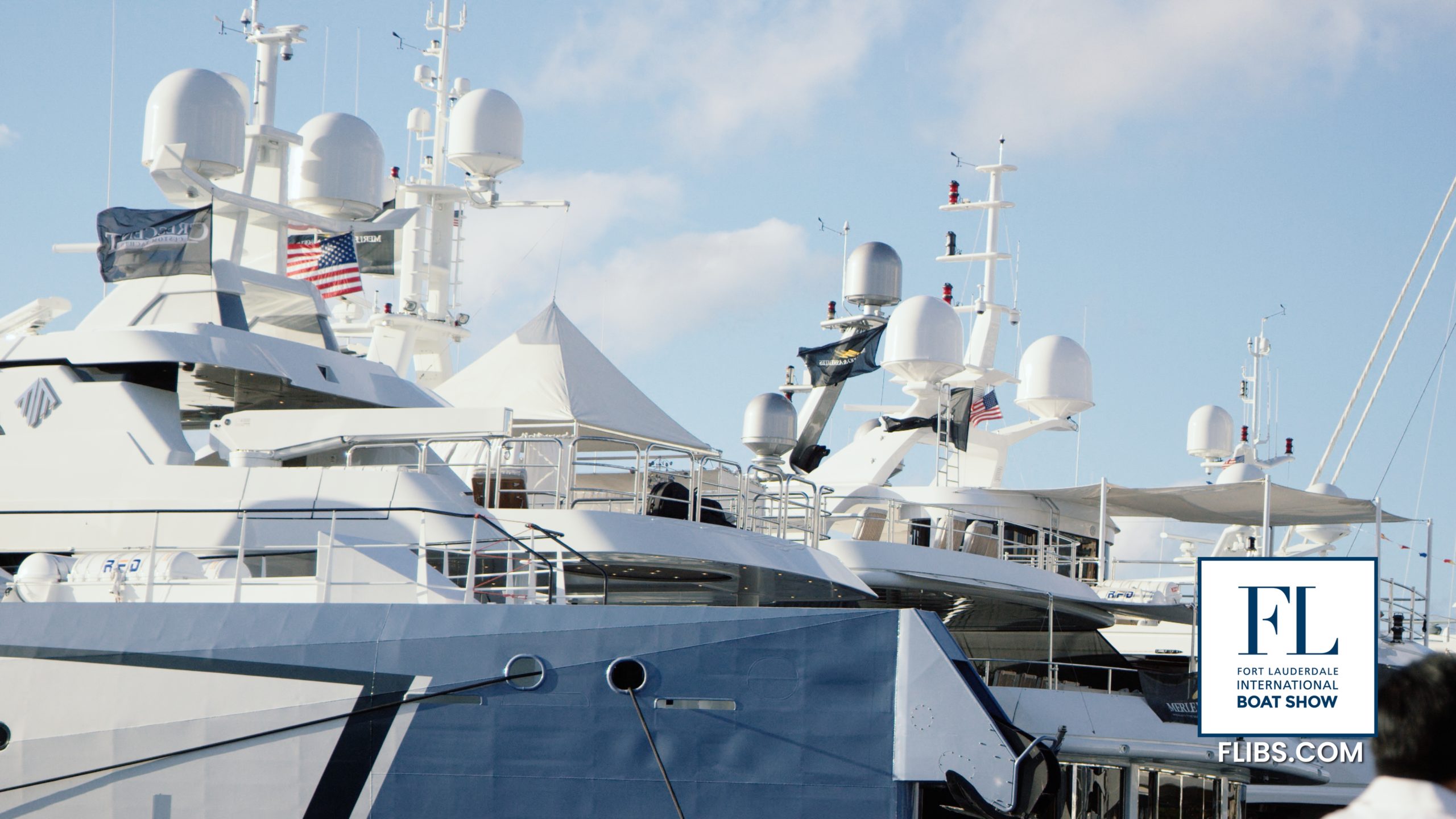 IU C&I Studios Page Fort Lauderdale International Boat Show Side view of a few yachts in a dock