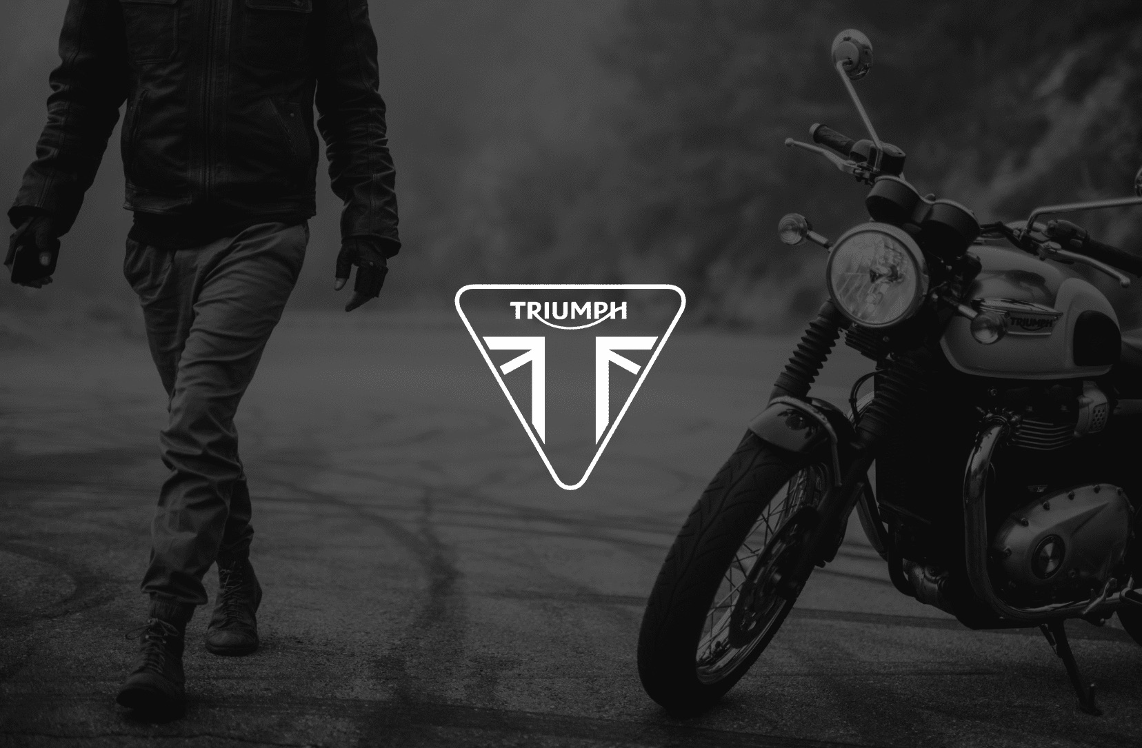 Keyword: Triumph Motorcycles .IU C&I Studios Page White Triumph logo with black and white photo of the rider walking away from the Bonneville T100 in the background