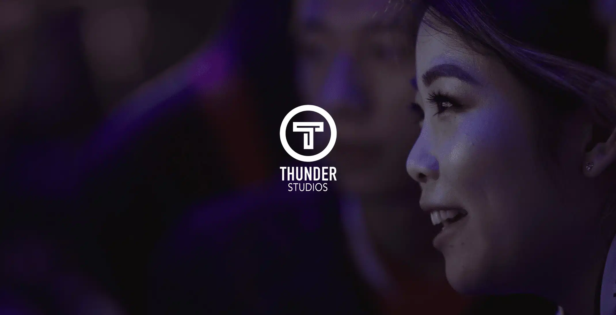 Examples of live streaming work White Thunder Studios logo with background side profile of an Asian woman smiling. Live streaming