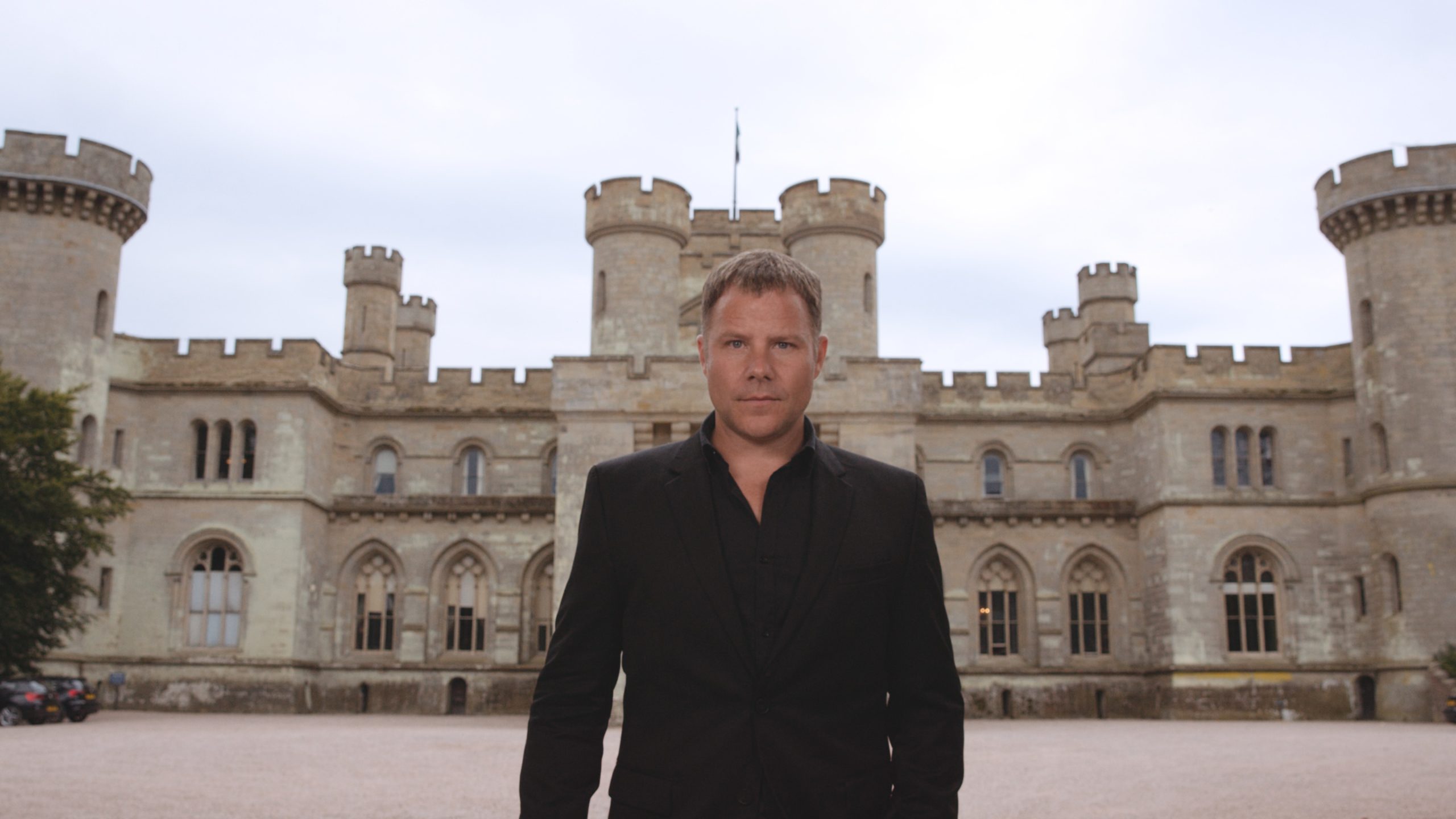 IU Top Recruiter Man standing in front of castle posing for the camera