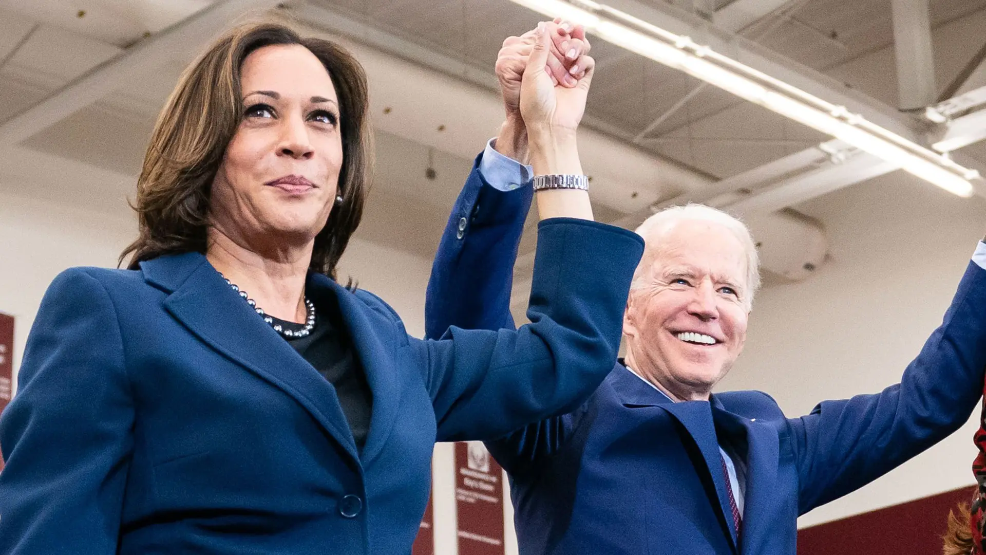 cis-post-everything-you-need-to-know-about-producing-political-and-corporate-videos Headshot of Joe Biden and Kamala Harris holding hands up in celebration