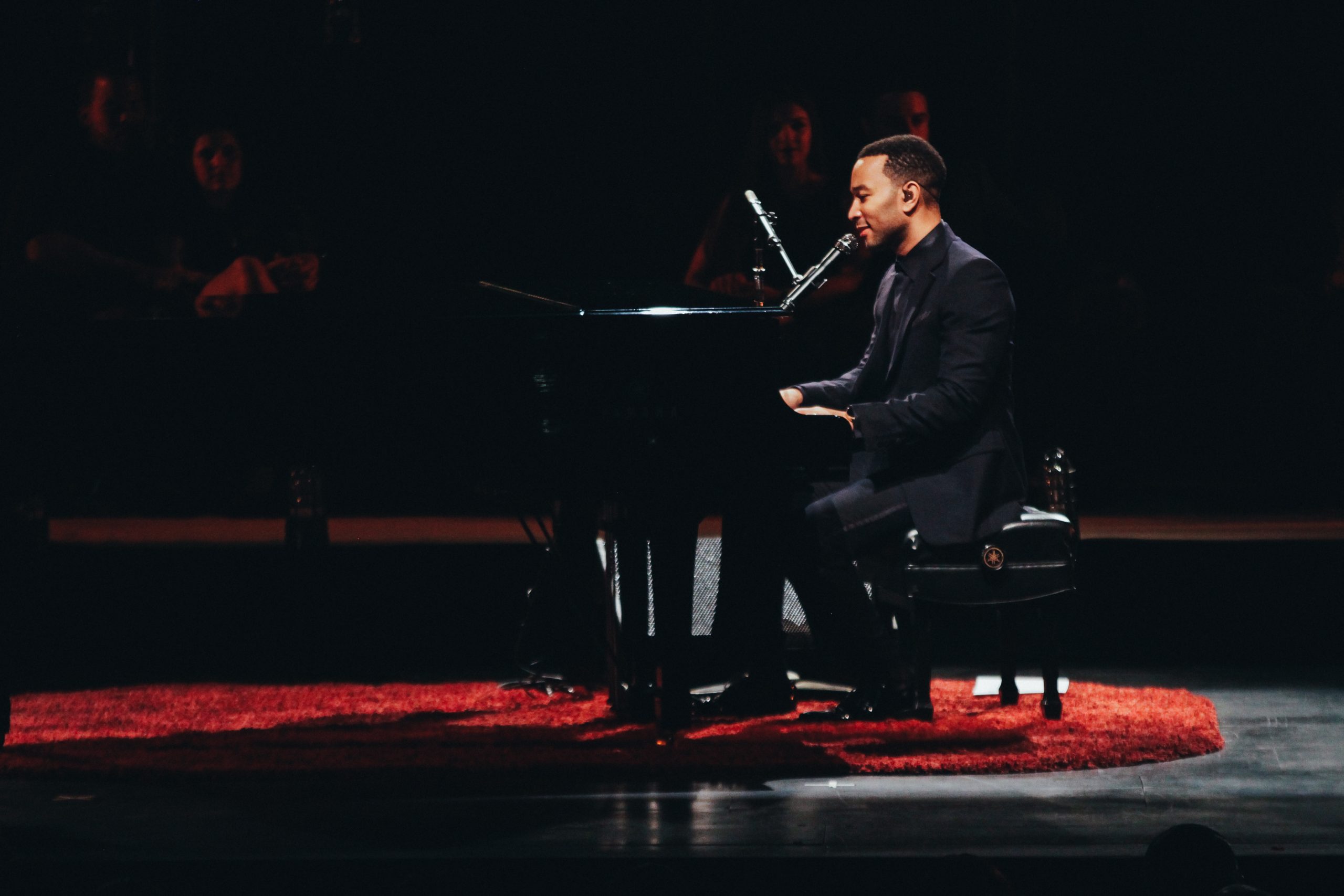 Side profile of John Legend on stage