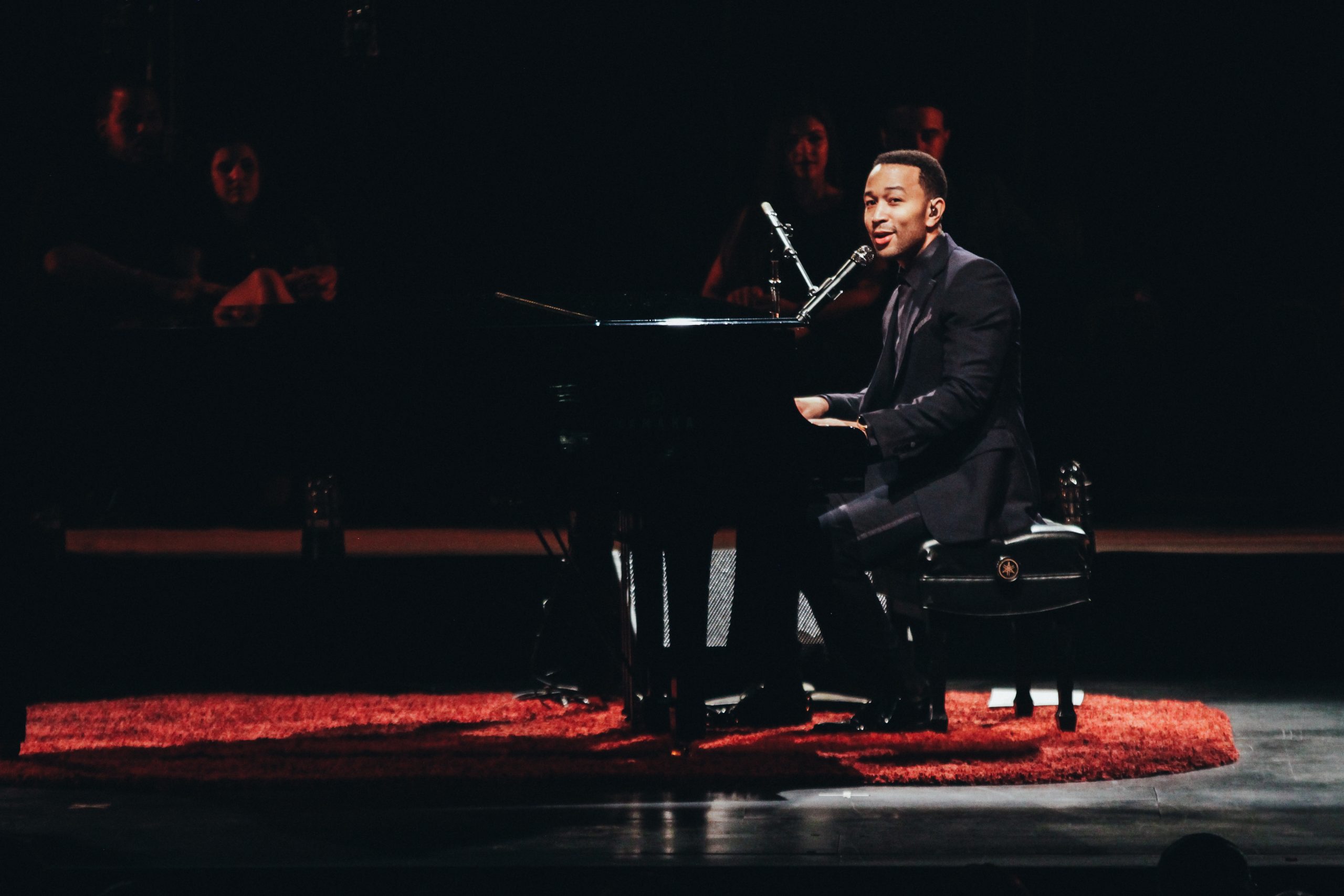 Side profile of John Legend on stage