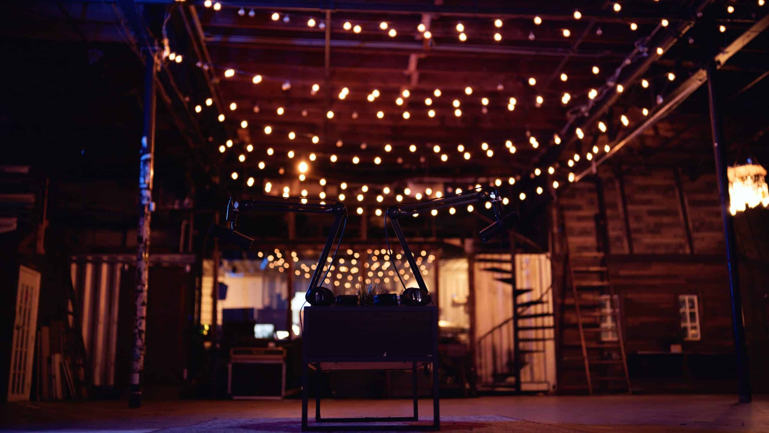 Podcasts vs. Docuseries How Longform Content is Changing the Game Side profile of two headphones on a table in a studio