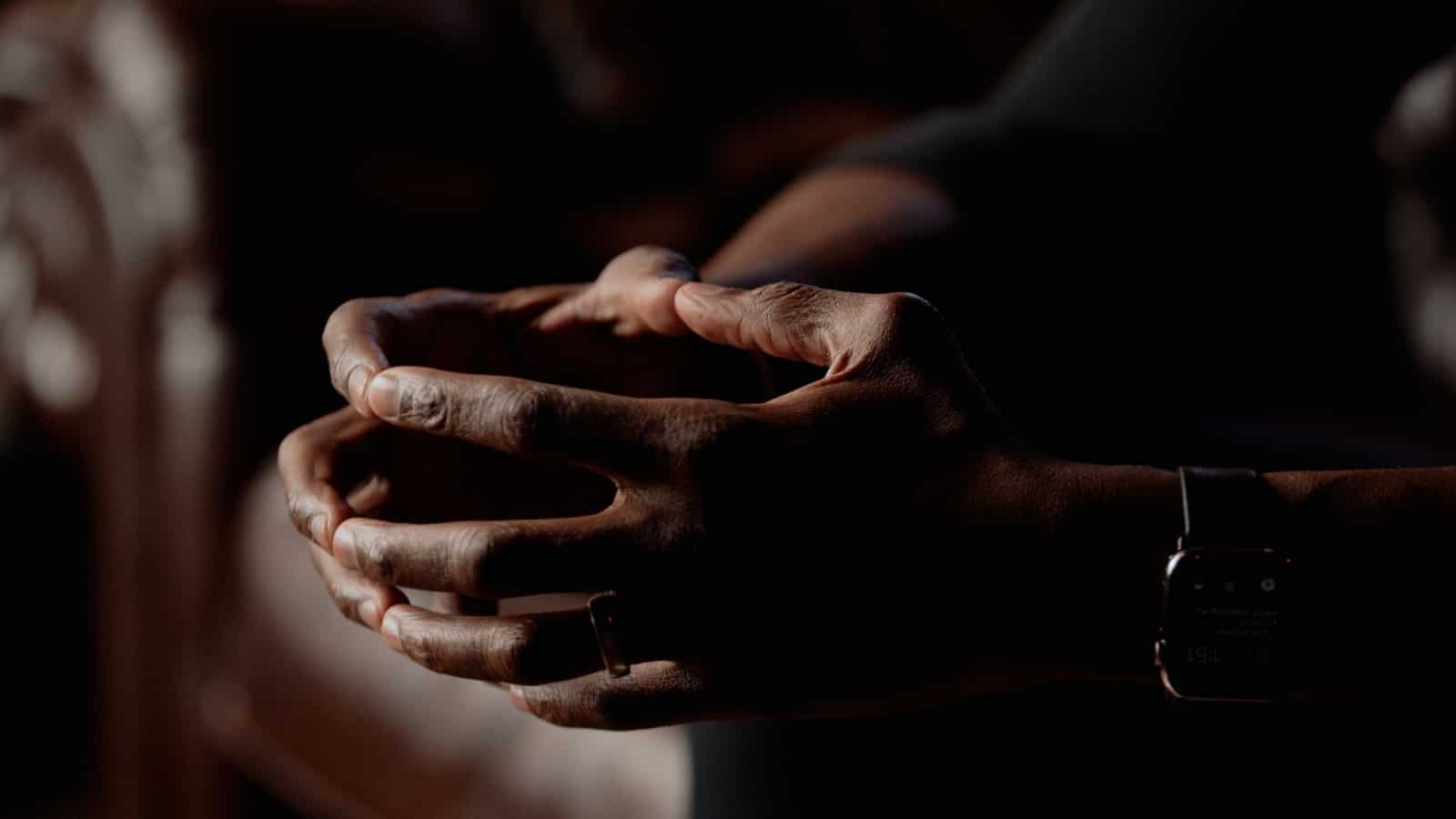 The Power of Storytelling in Corporate Videos Closeup of hands with watch on the arm