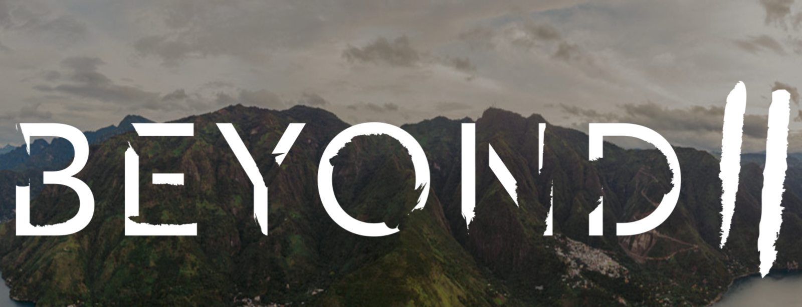 IU C&I Studios Page and Post The Role of Typography in Logo Design White Beyond II logo against mountain backdrop