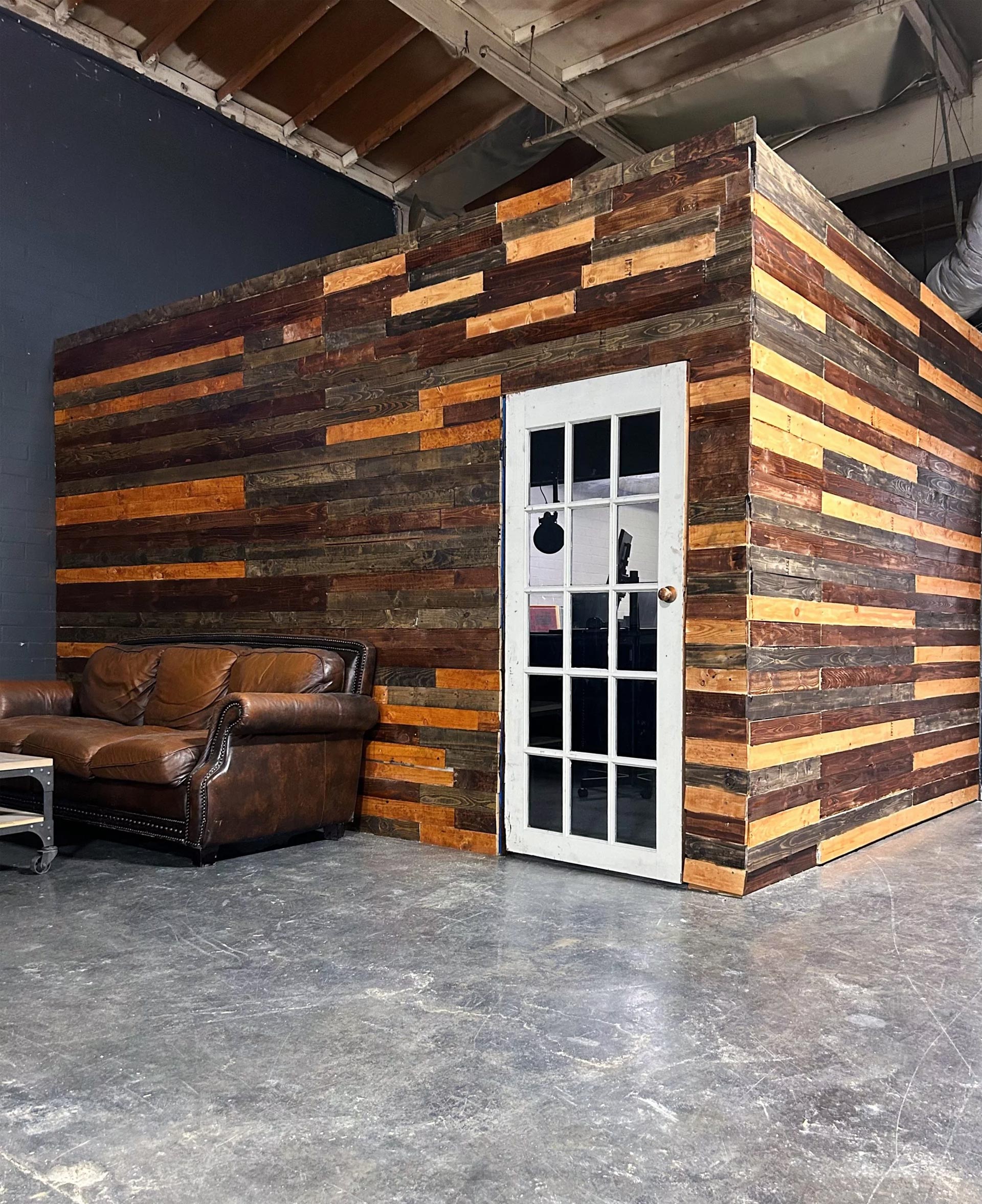 LA Vocal Booth with leather couch outside of it