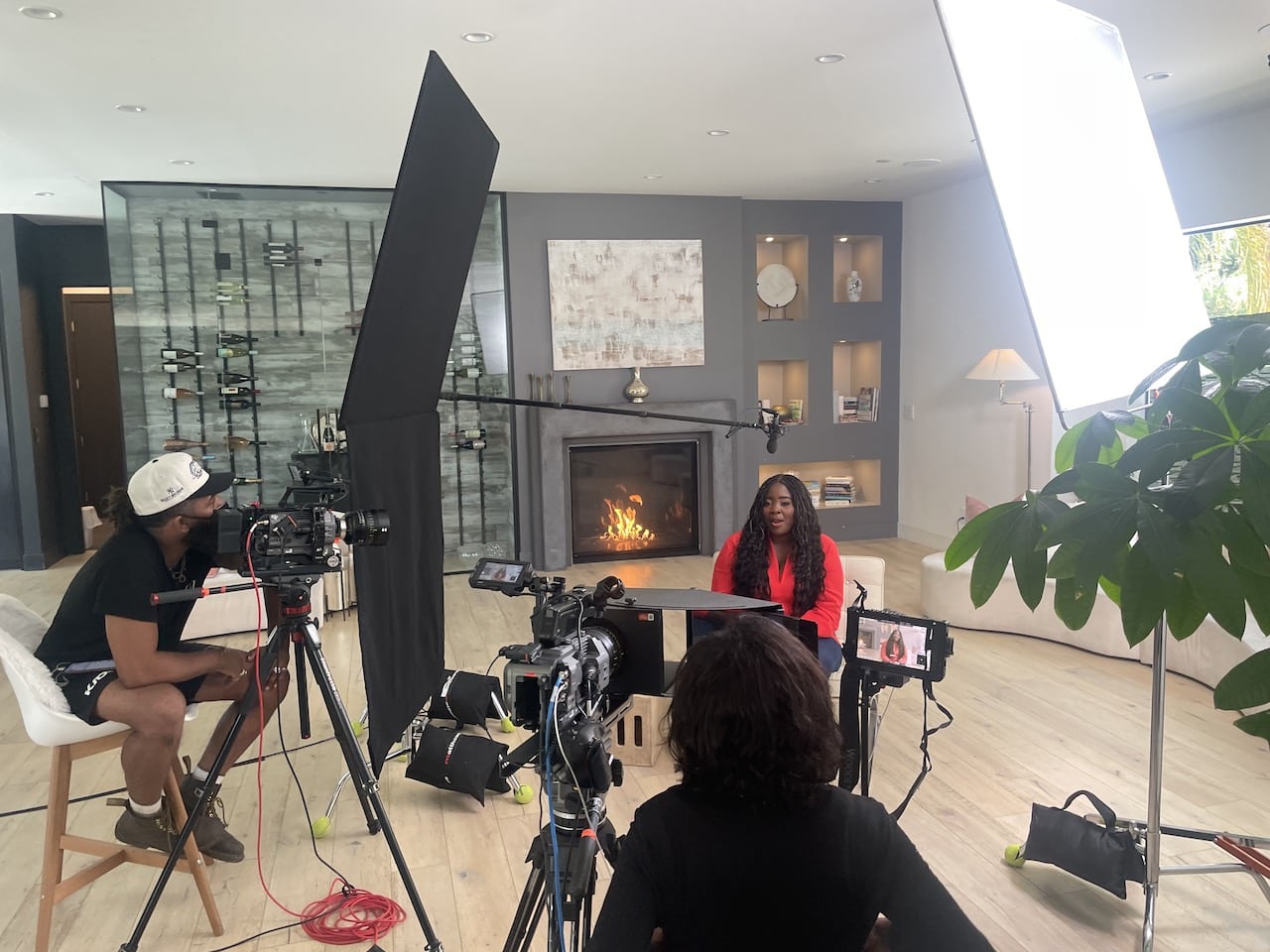 Kim Kimble on set with crew members and equipment