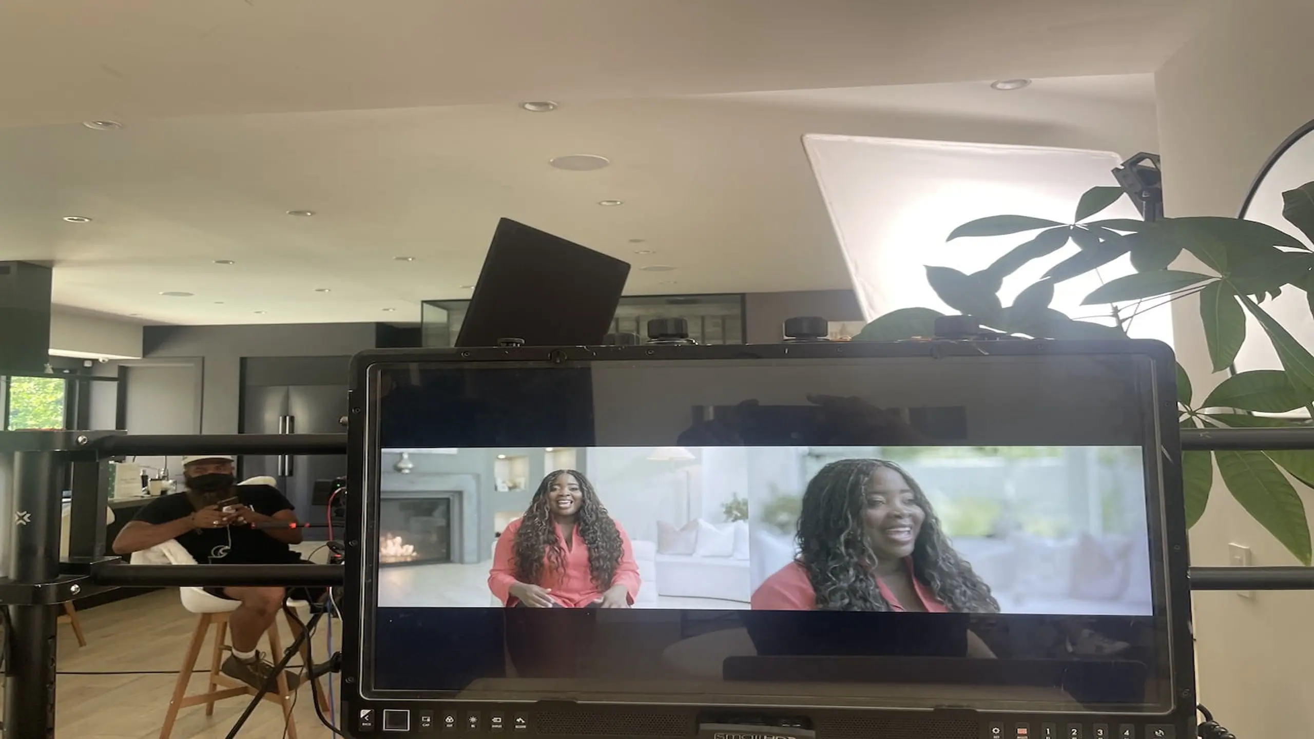 Closeup of video display with Kim Kimble on it