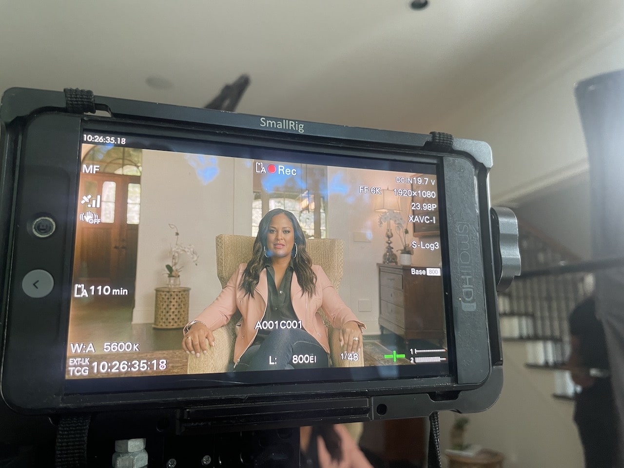 Closeup of video monitor with Leila Ali on it