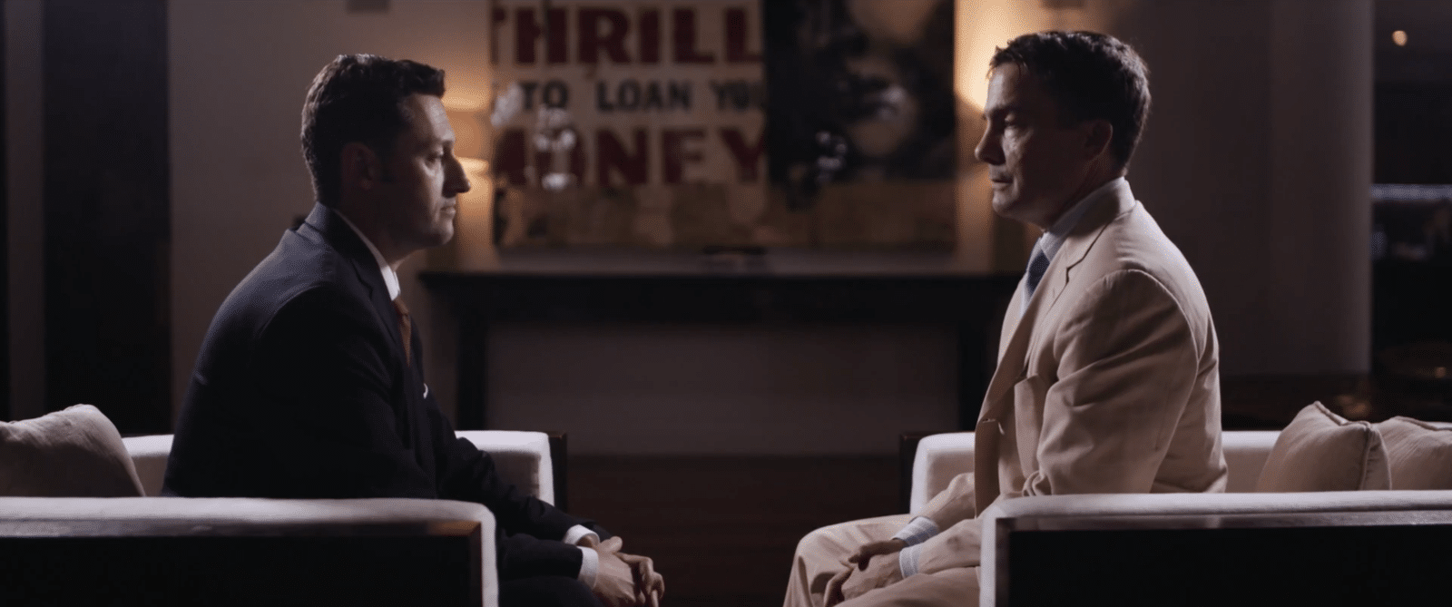 Reality TV Screenshot of two men sitting in chairs facing each other