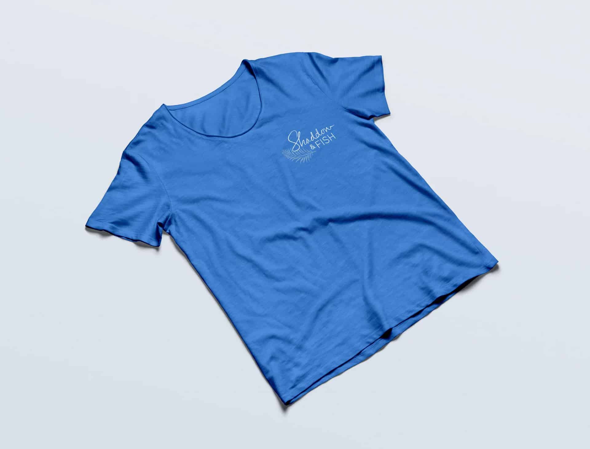 Logo Design Light blue Shaddon & Fish t shirt on display