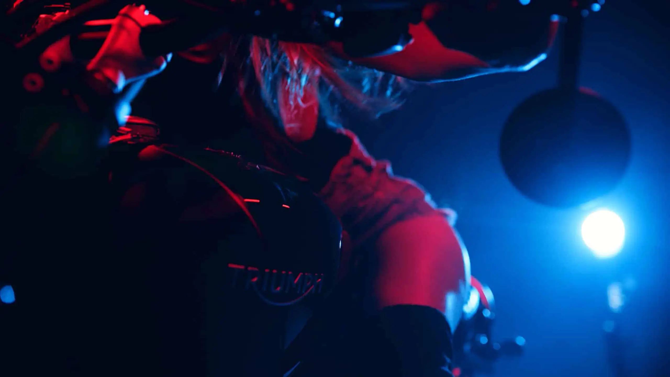 View from behind of Beatriz Corbet on motorcycle