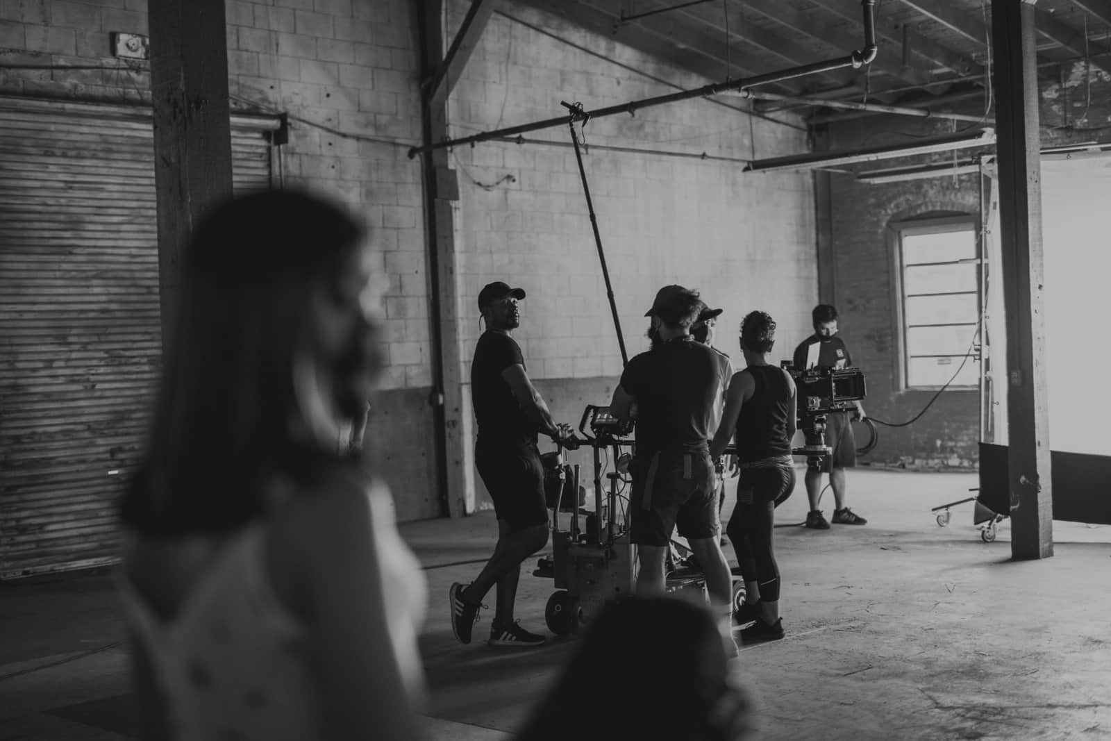 Black and white of crew members working on set