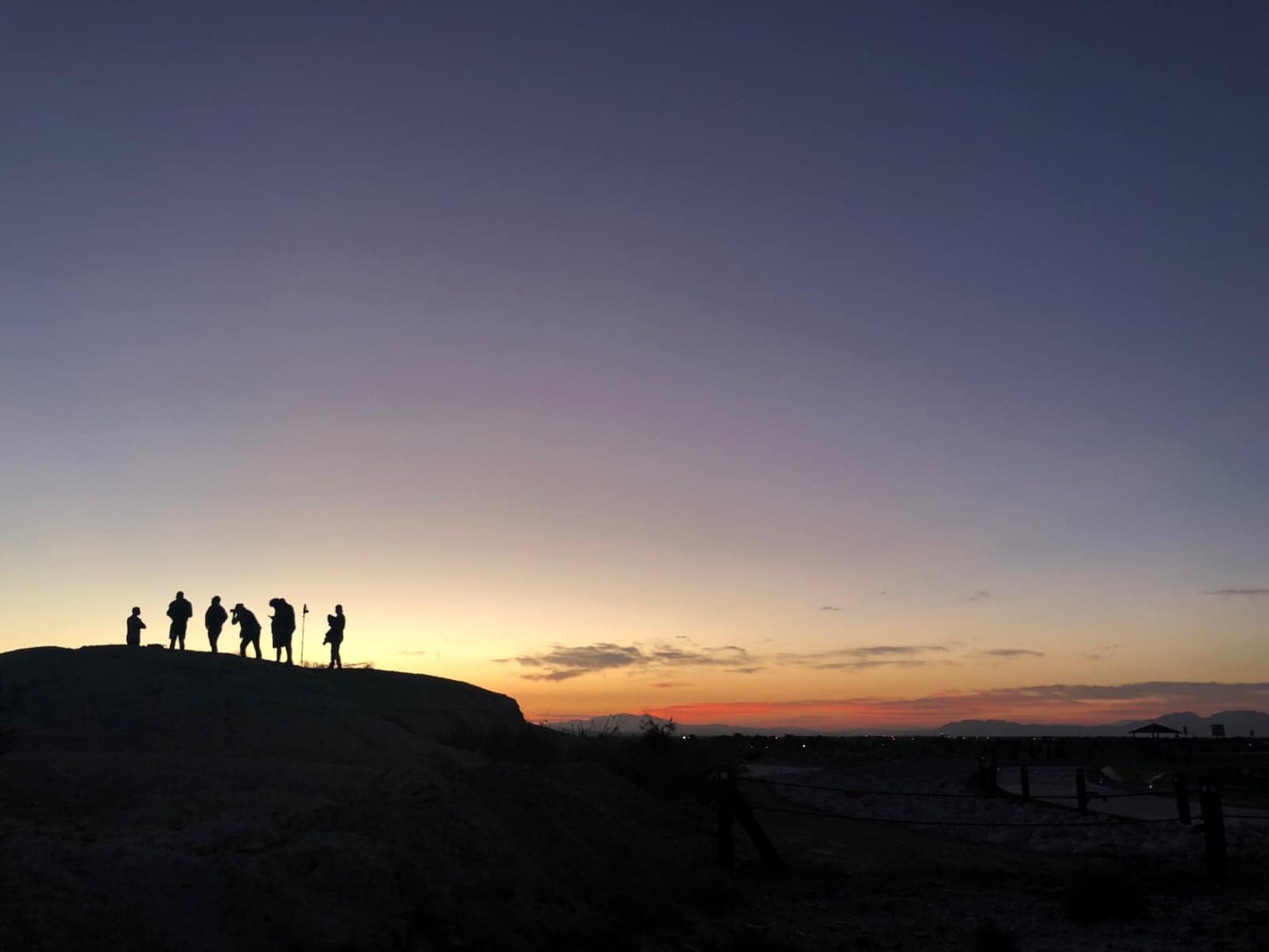 TV Proposal with six crew members at work on a hill at dusk