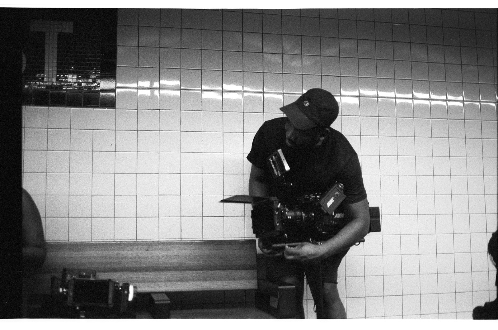 IU Black and white side profile of Joshua using a video camera