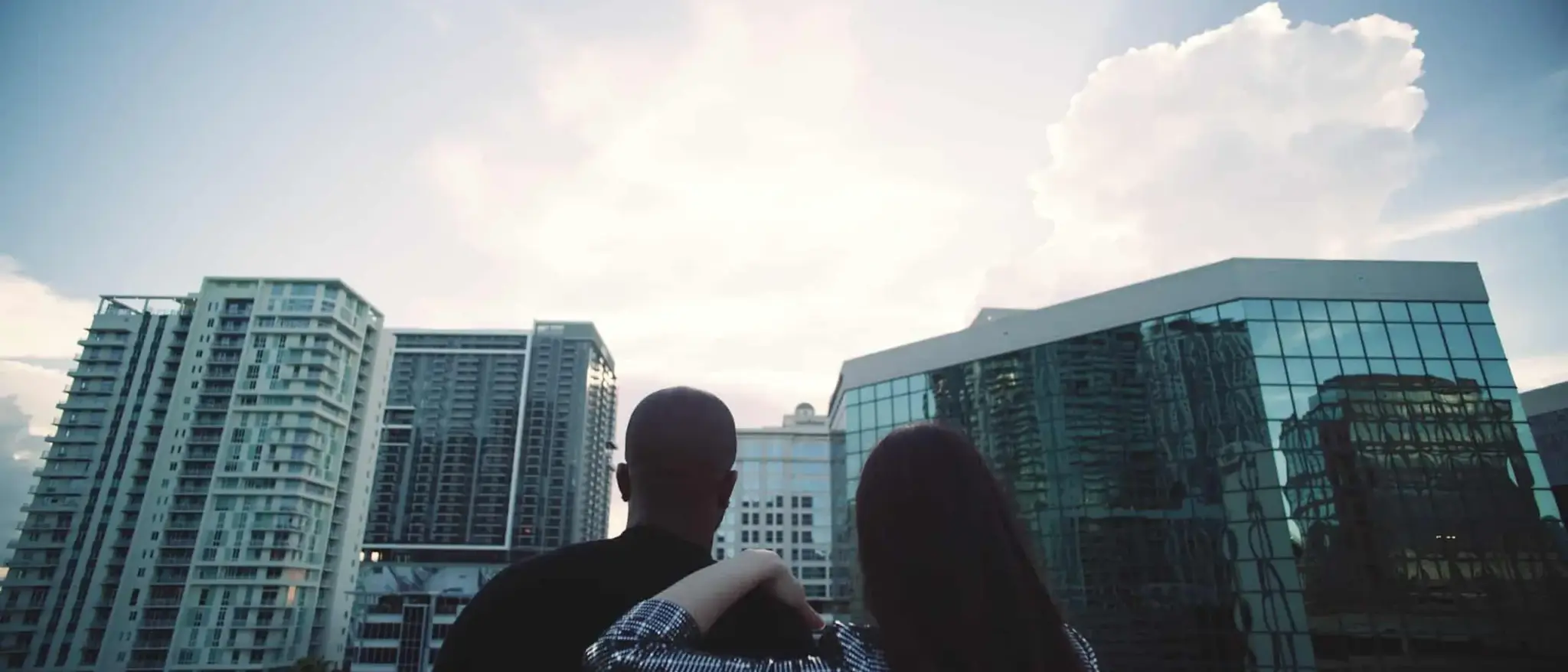 cis-page-tv-show-pitch10 View from behind of man and woman looking out over the city