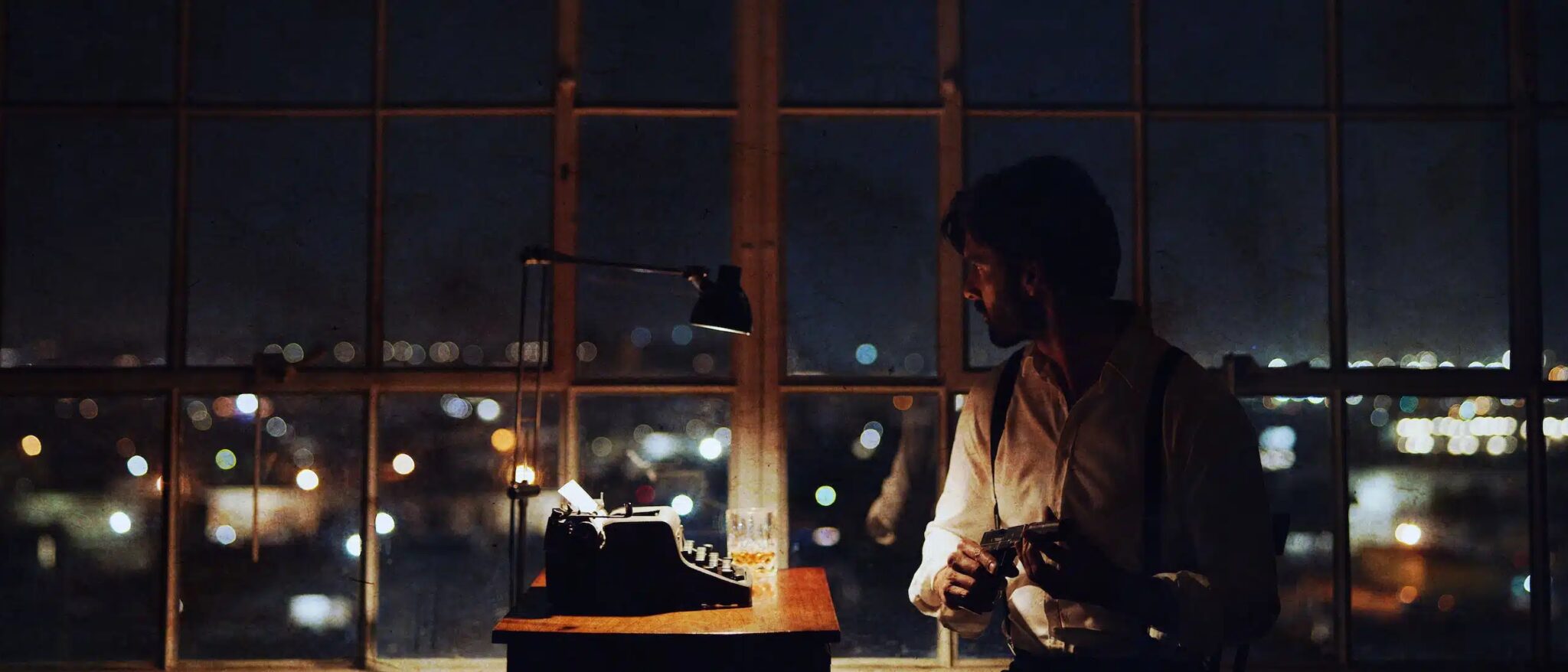 The American TV Show Pitch Side profile of a man sitting by a typewriter
