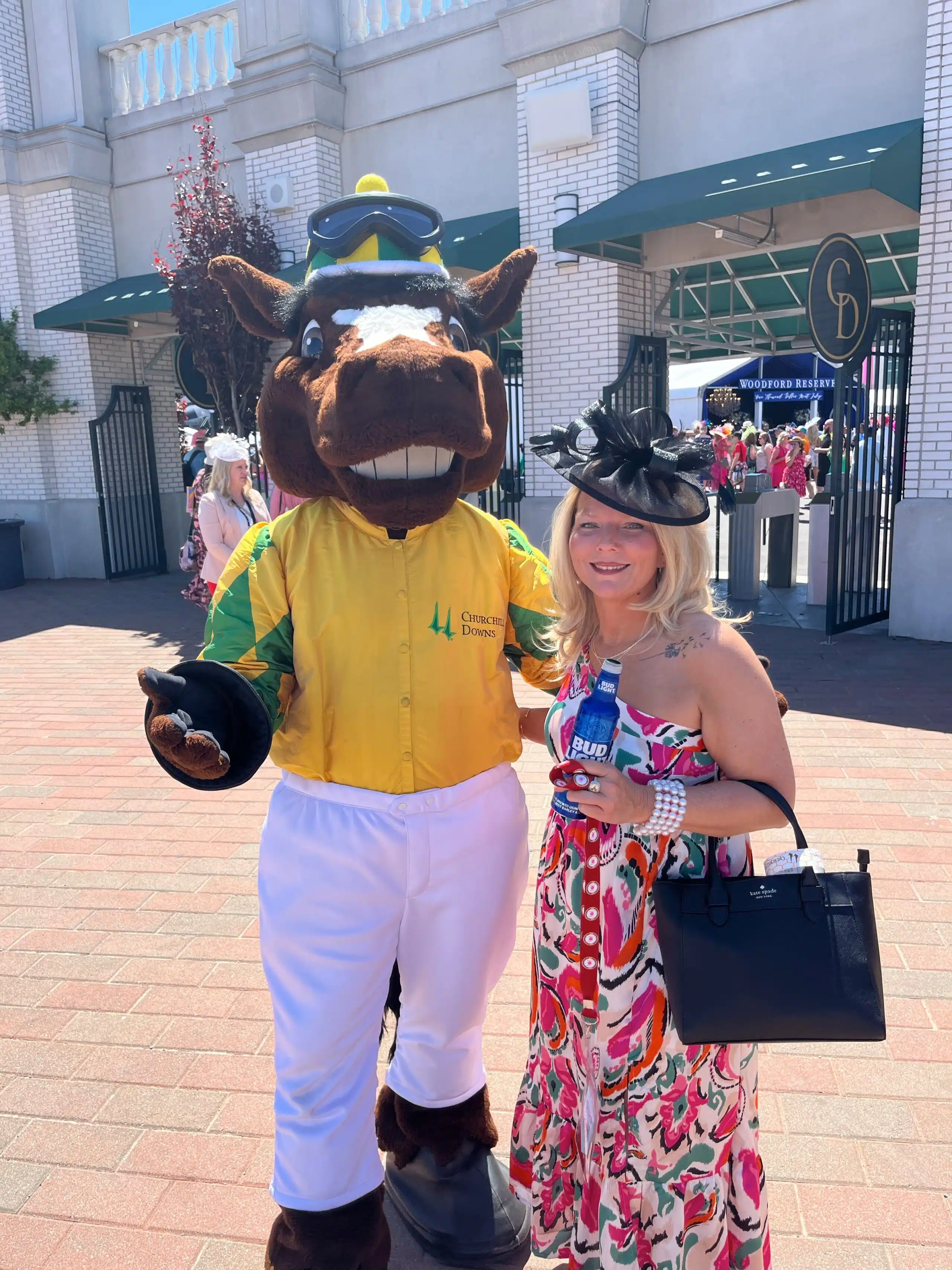 DIRECTV Dream Derby Experience Sweepstakes winner, Erica Sluder posing for photo with the derby mascot