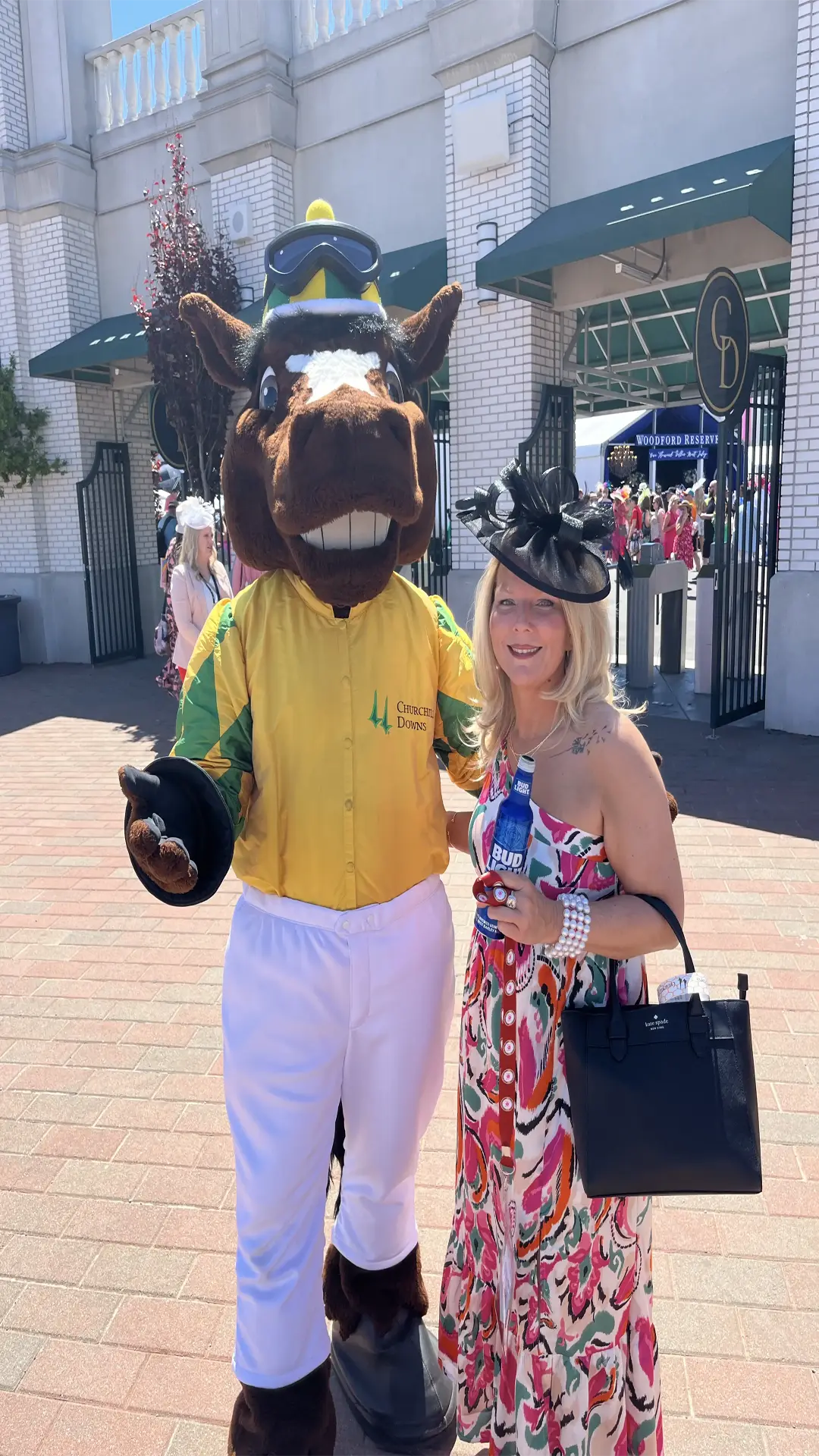 DIRECTV 2 Sweepstakes winner, Erica Sluder posing for photo with the derby mascot