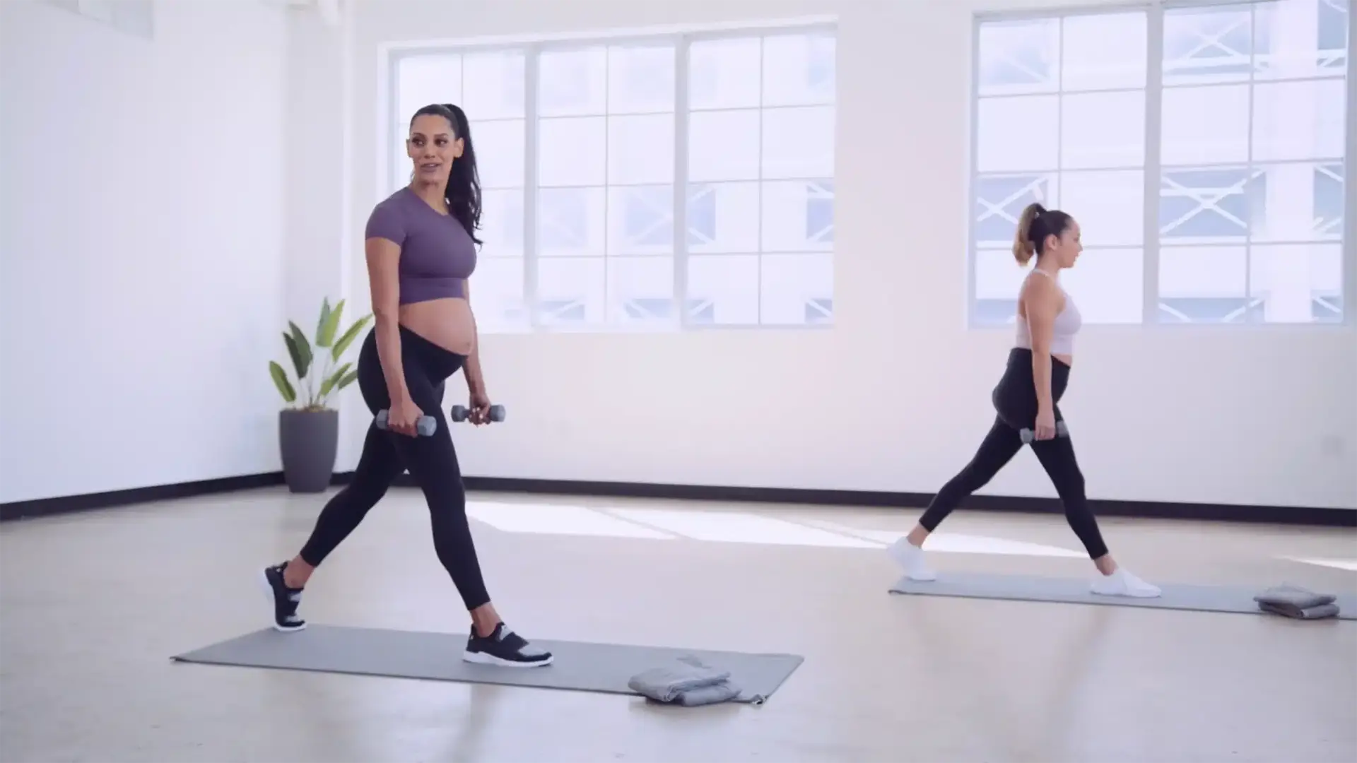 Empowered Media 2 Two female exercisers doing dumbbell exercise moves