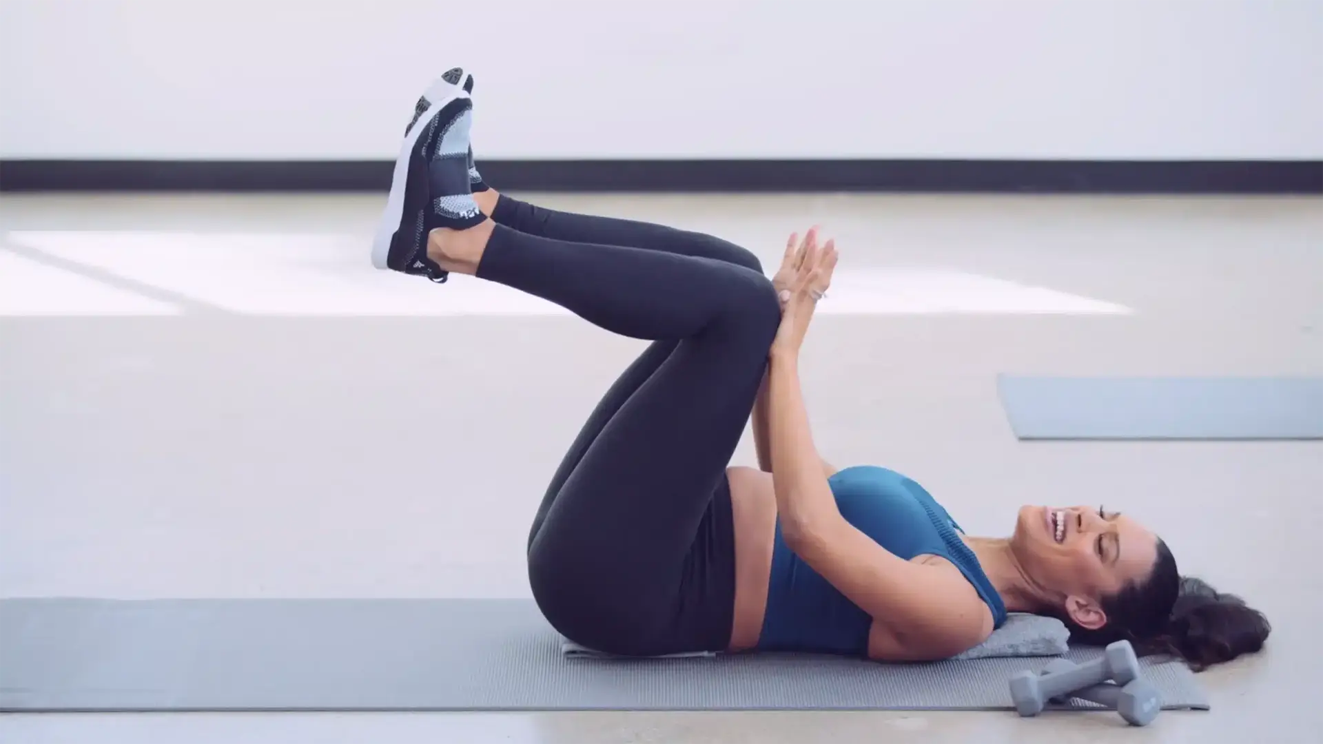 Empowered Media 9 Side profile of female exerciser with knees up