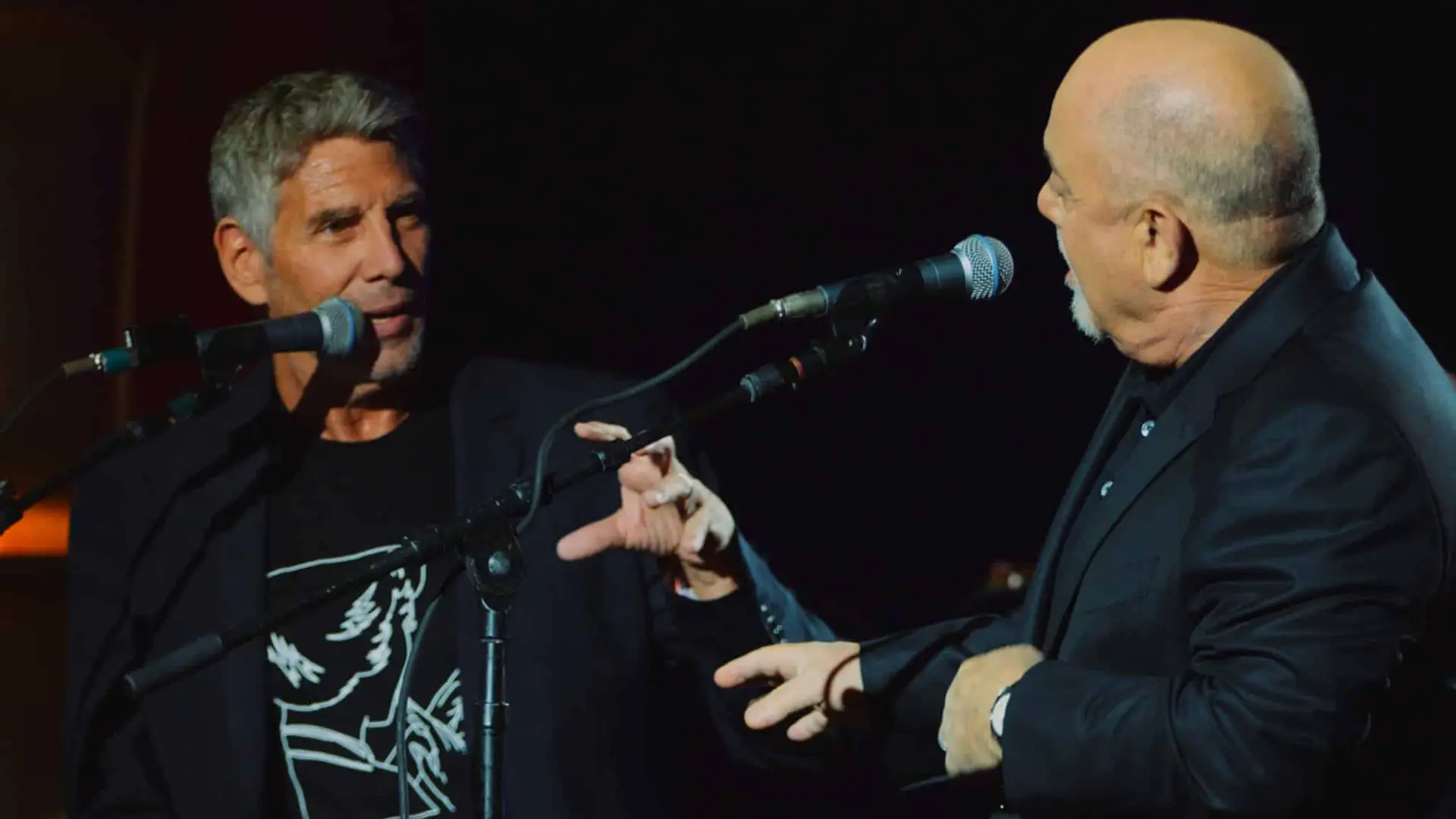 Billy Joel 3 Billy Joel talking to man on stage