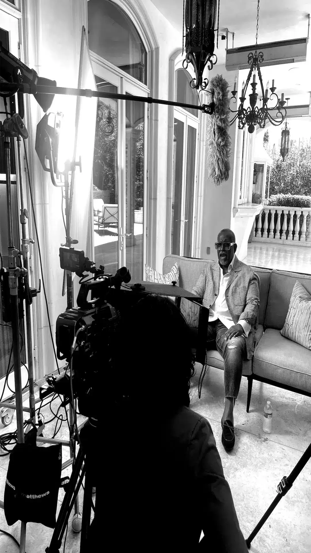Black and white of African American man talking to camera