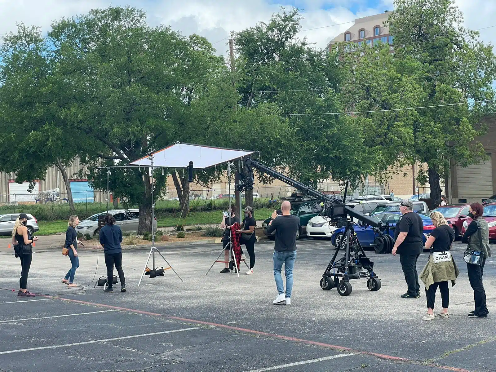 Essential Steps for Feature Film Pre-Production. Production crew on site with flags and jib