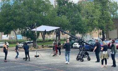 Essential Steps for Feature Film Pre-Production. Production crew on site with flags and jib