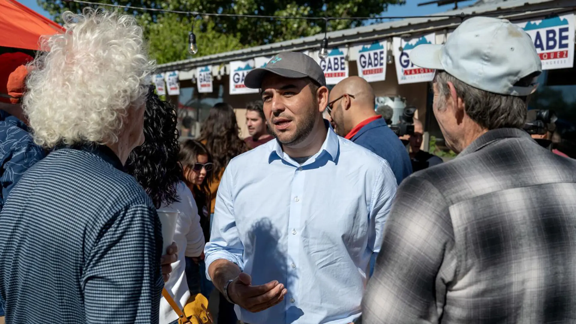 Gabe Vasquez 8 Gabe Vasquez talking to two supporters