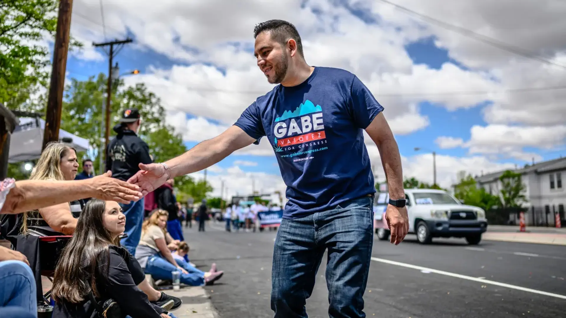 Gabe Vasquez 4 Side profile of Gabe Vasquez shaking hands with supporters