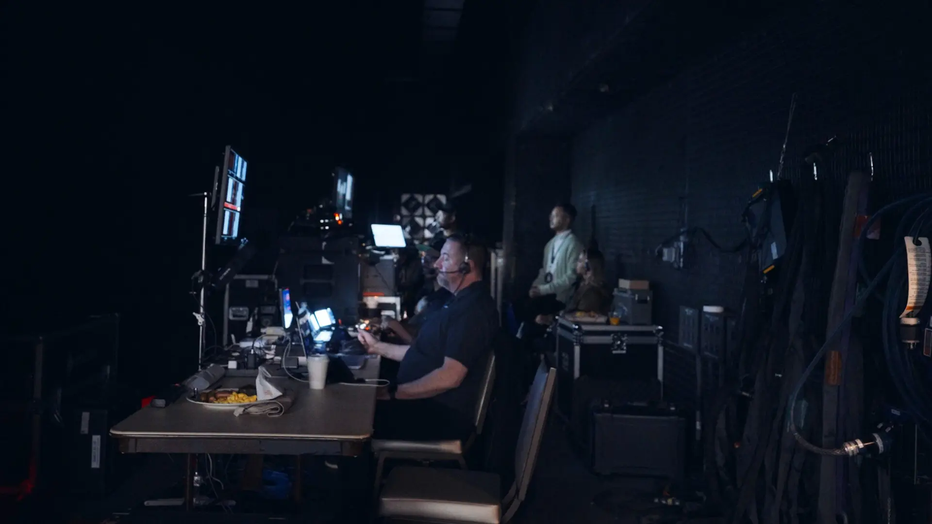 H&M 82 Side profile of crew members working behind the scenes