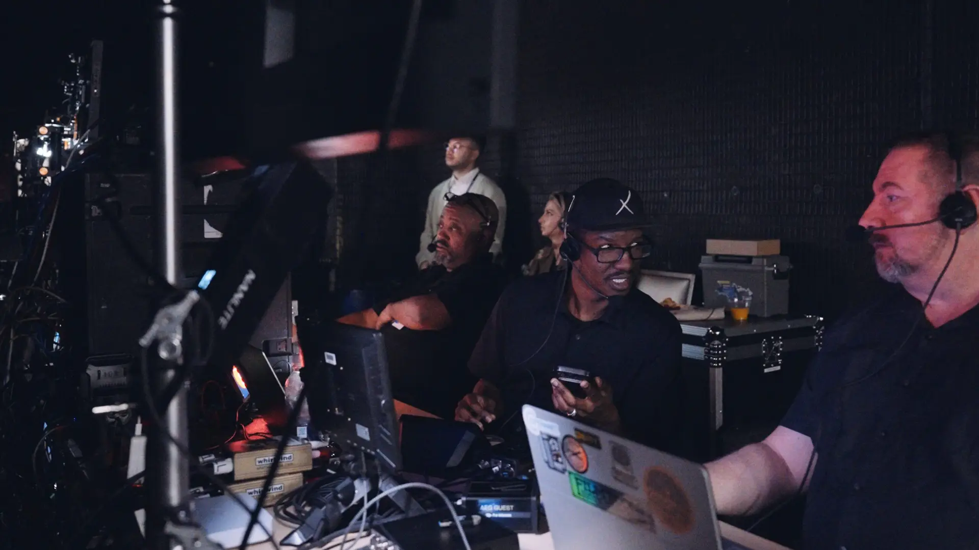 H&M 81 Side profile of Joseph and other crew members working behind the scenes