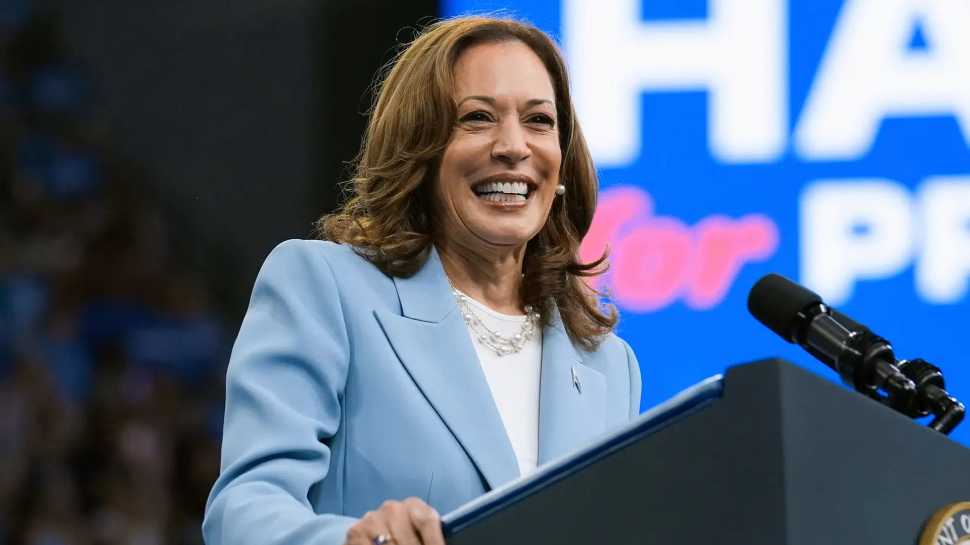 Kamala Harris 3 Kamala Harris smiling behind podium