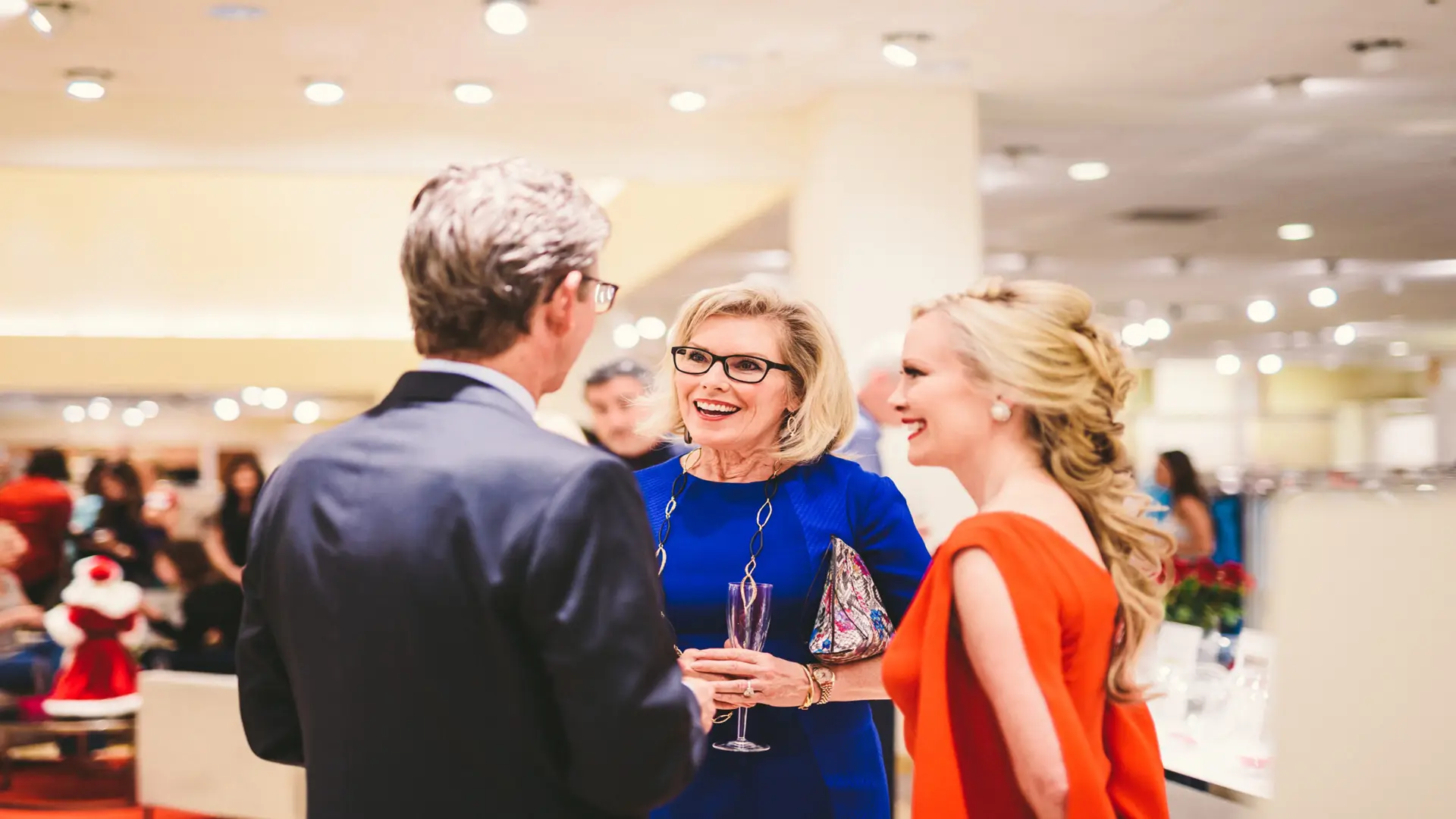 Neiman Marcus 17 Two women and a man talking