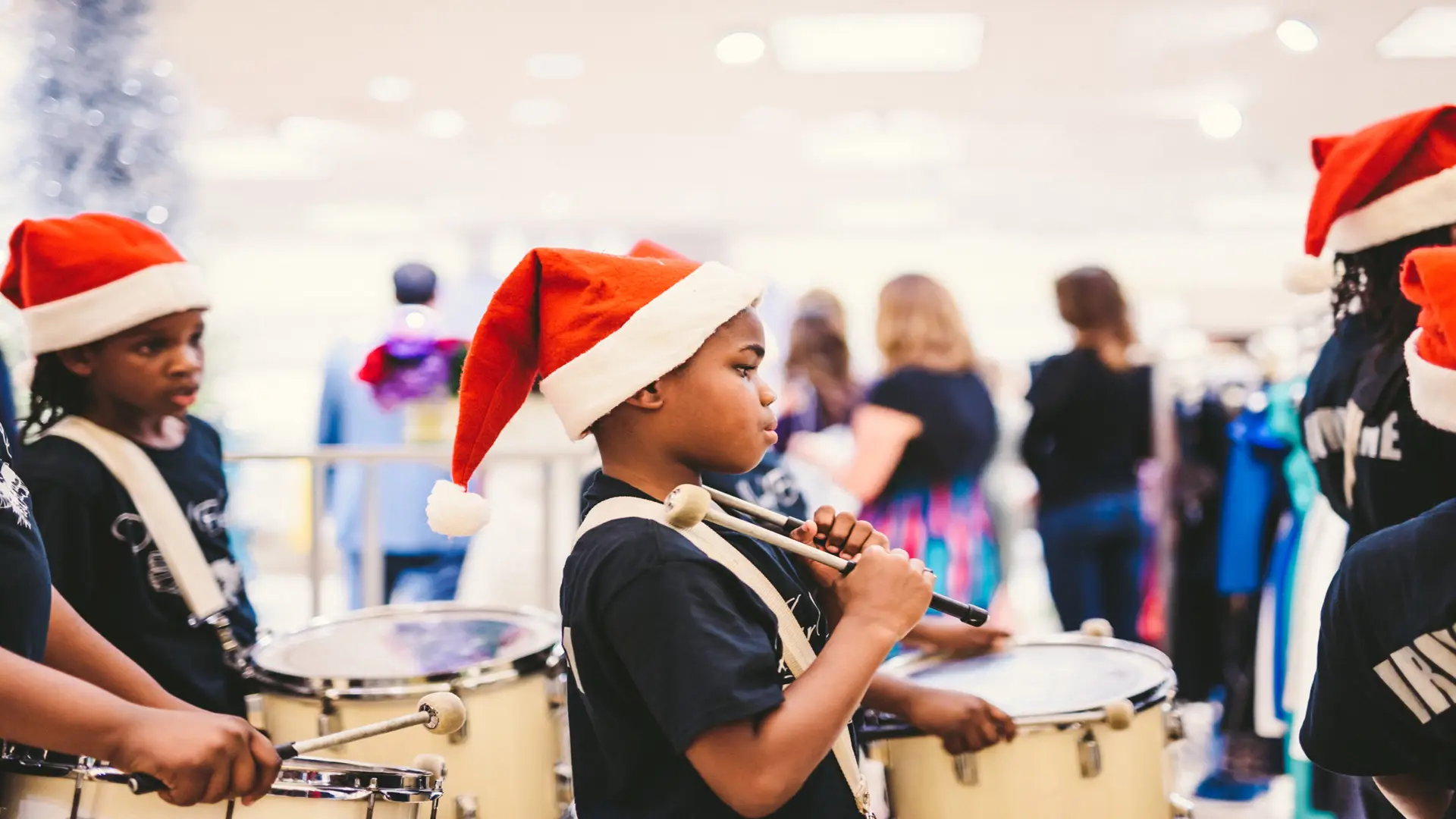 Neiman Marcus 4 Side profile of children wearing Santa hats
