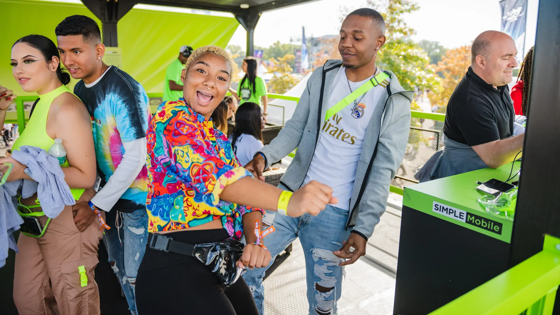 Rolling Loud 22 Men and woman in Simple Mobile booth