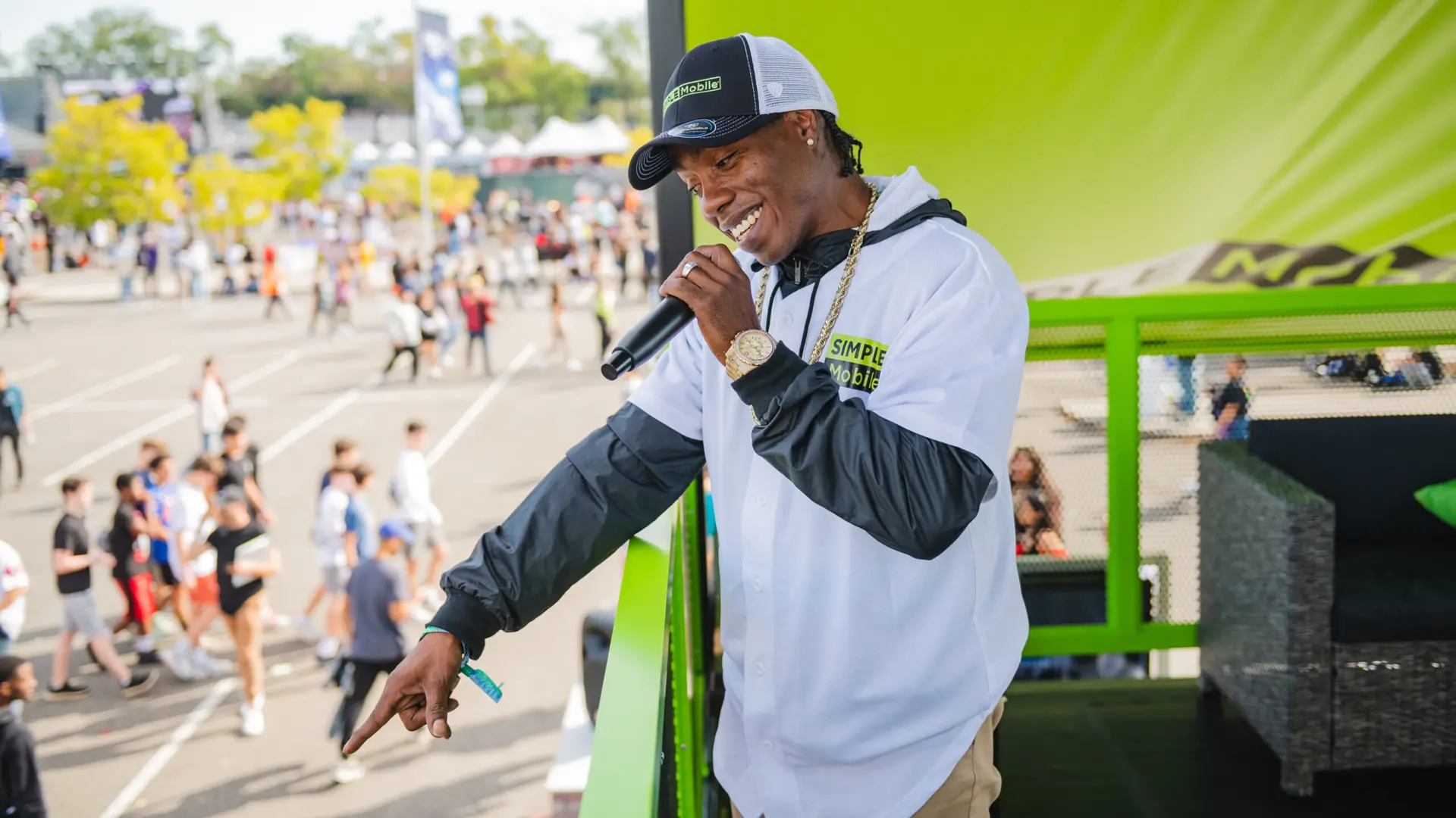 Rolling Loud 23 Side profile of man talking in microphone to someone in crowd