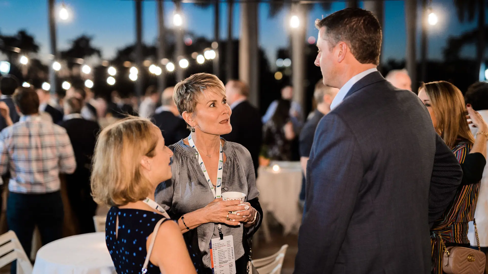 SFBTA 33 Man and two women talking in courtyard