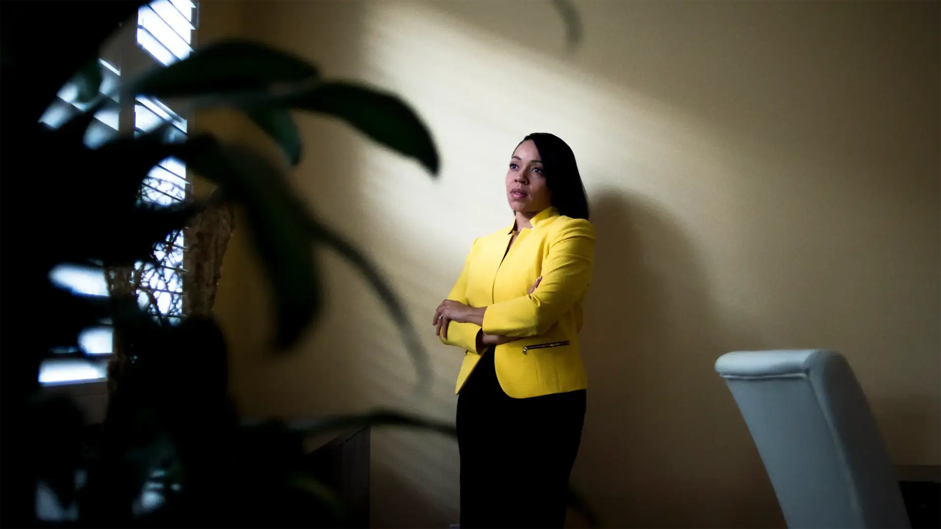 Aramis Ayala 6 Aramis Ayala standing in room looking off camera with sunlight filtering in on her