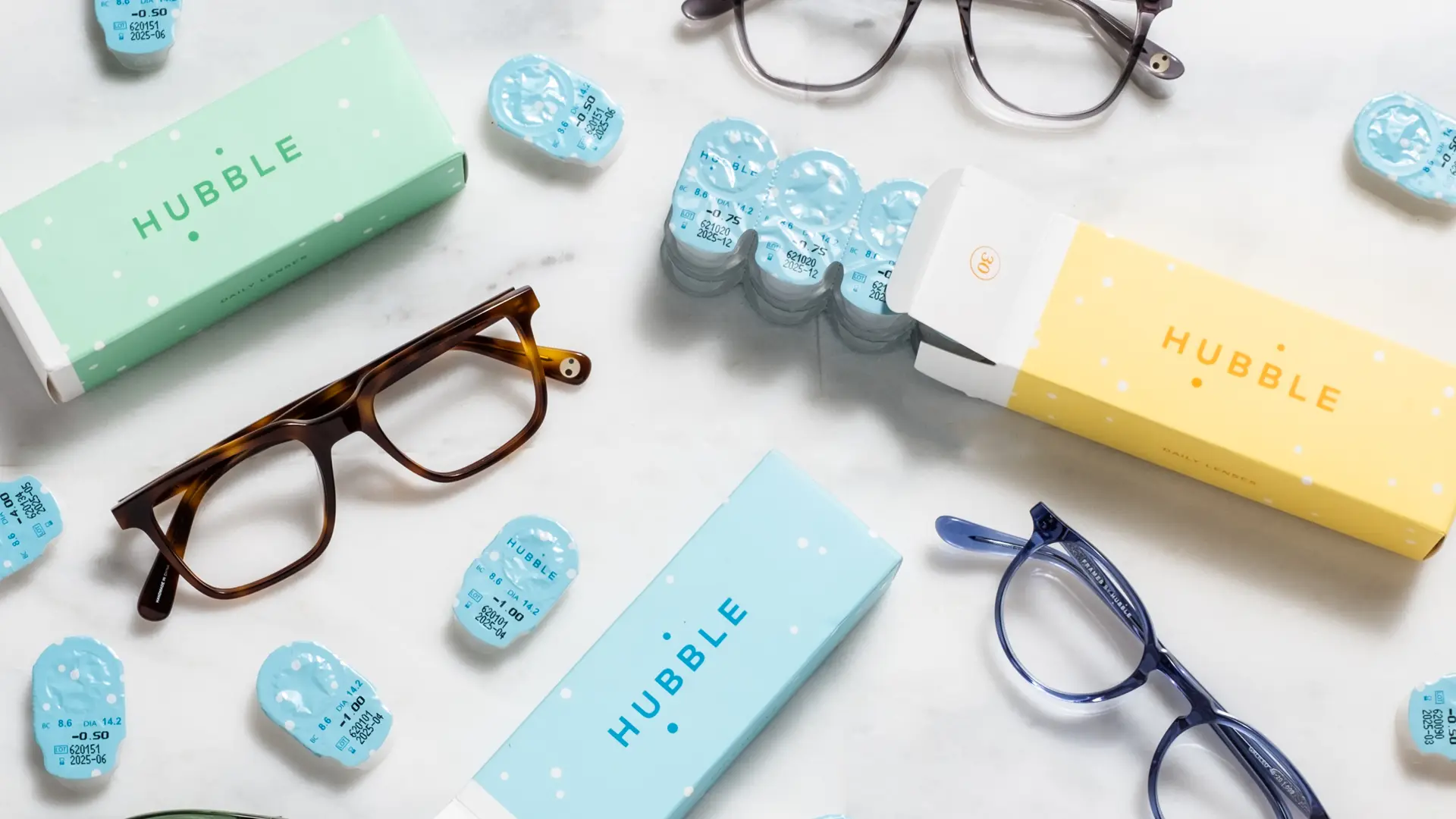 Product Photography 11 Hubble contact lens boxes and eyeglasses arranged as a flat lay
