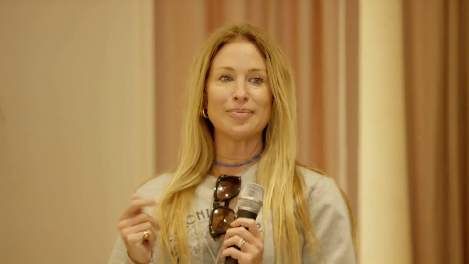 Closeup of speaker at breast cancer awareness panel discussion in Miami