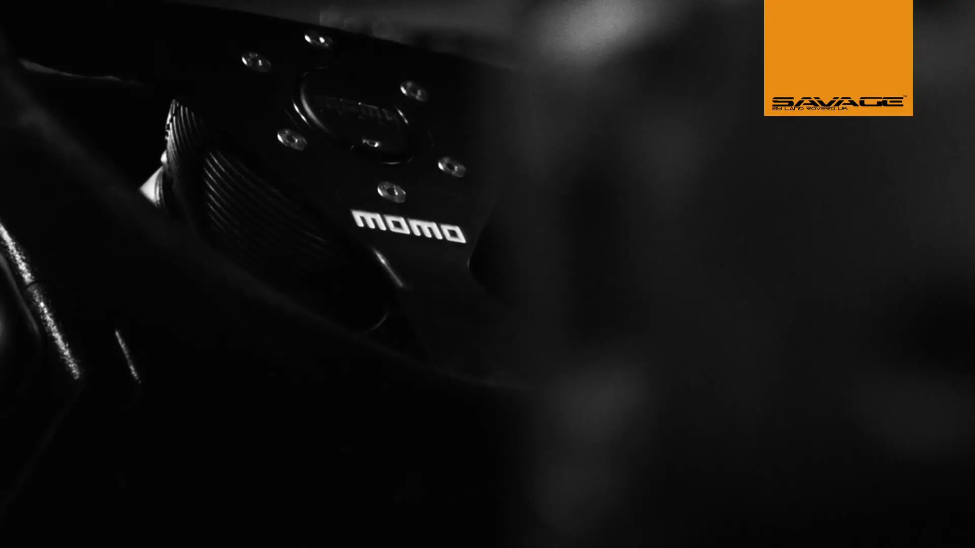 Land Rover UK Savage Defender 4 MOMO steering wheel detail inside Land Rover Defender