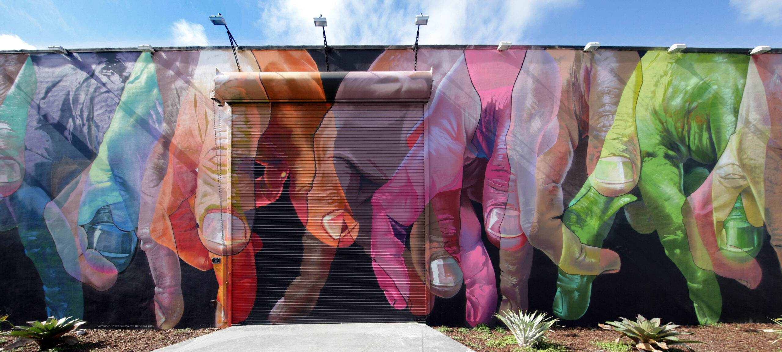 Wynwood Street Art Mural Colorful Hands Wynwood street art mural featuring colorful painted hands by The Ridiculous Hour Foundation