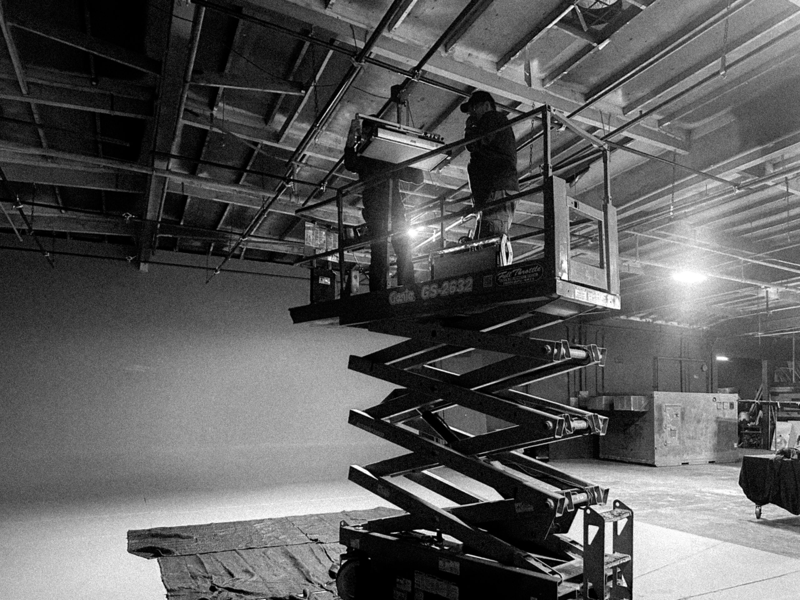 Lighting 9 Scissor lift adjusting lights at the Los Angeles film production studio