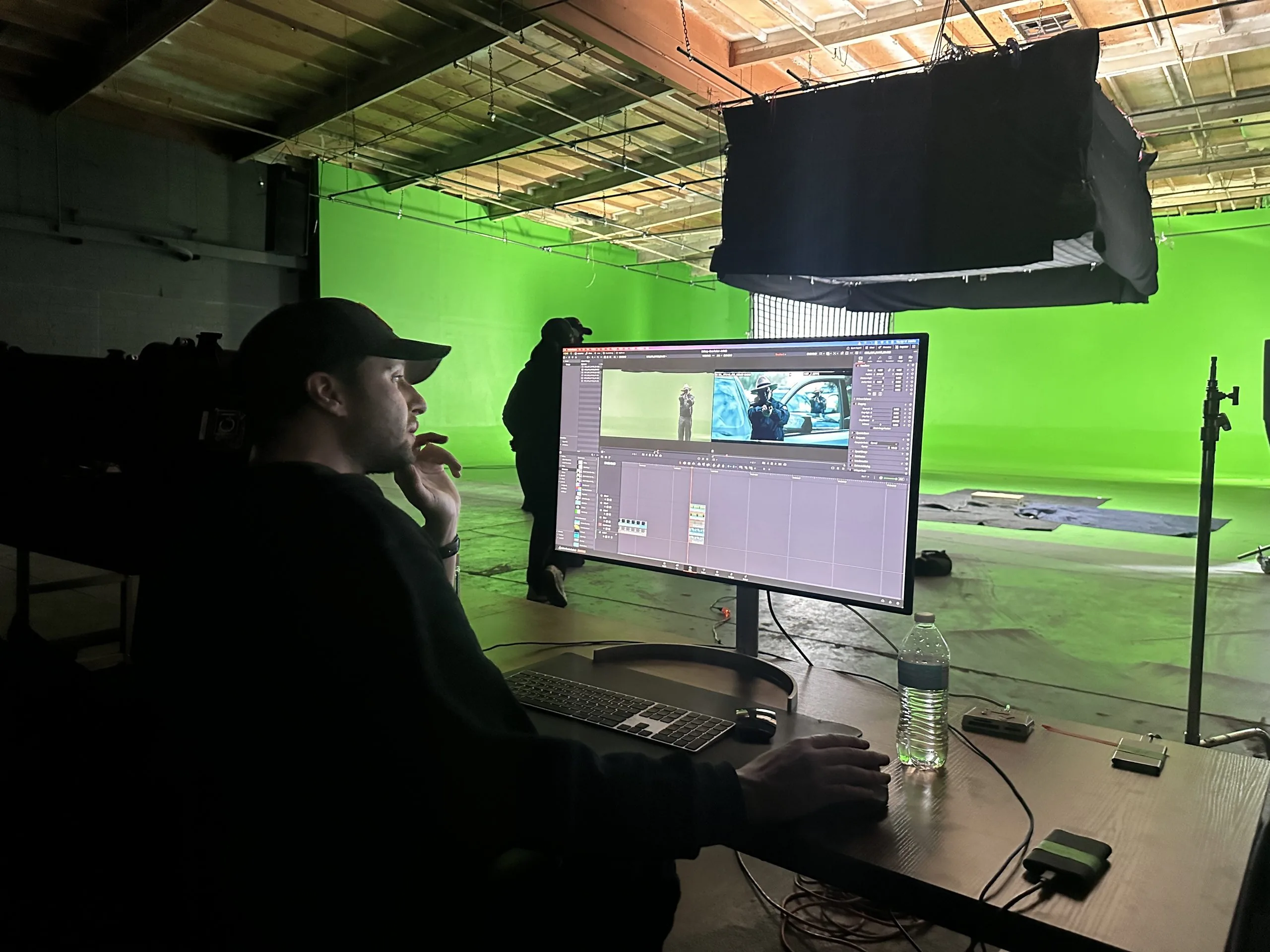 How to Hire a Production Crew in 2026 (Without the Hassle) 31 hire production crew - behind the scenes crew on green screen cyc wall